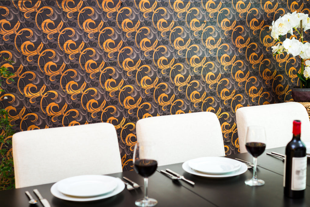 Brightly patterned timber panel walls add interesting diagonal vine pattern to dining room wall