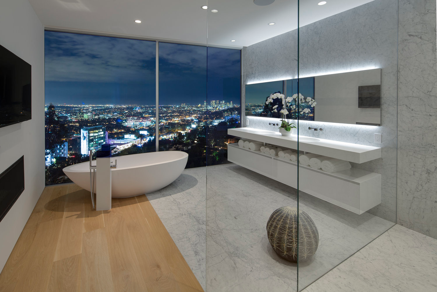 wall to wall glass enclosed bathroom