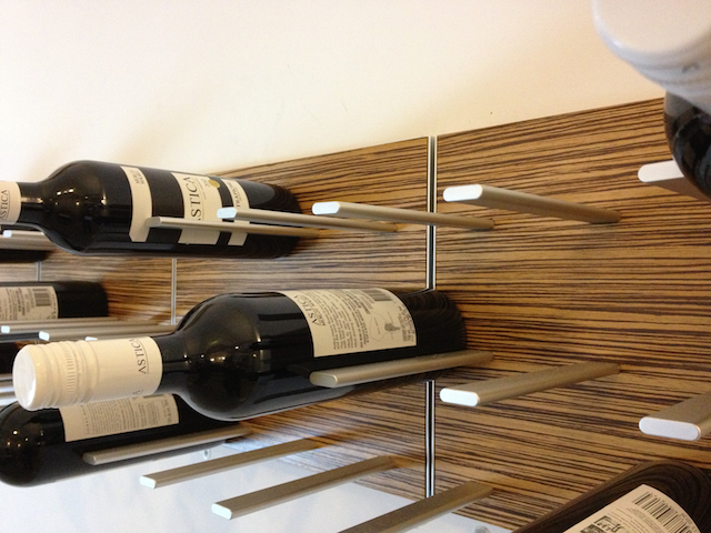 wine rack in exotic zebrawood via WSJ