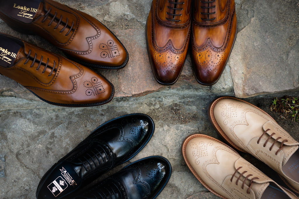 Four wingtip shoes in a circle