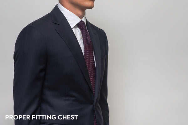 The chest of a suit that fits properly, showing no gape or break