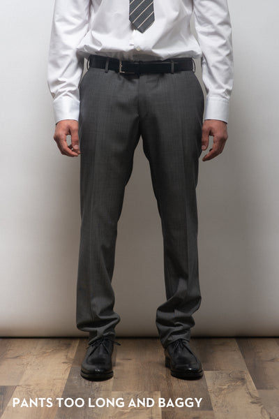 Dress pants on a suit that is too long and too baggy