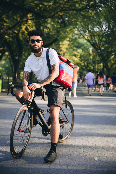 M24 lorry tarpaulin backpack being worn by a cyclist in central park