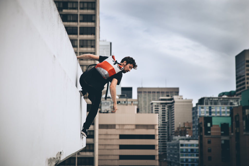 parkour-hanging-from-a-ledge 