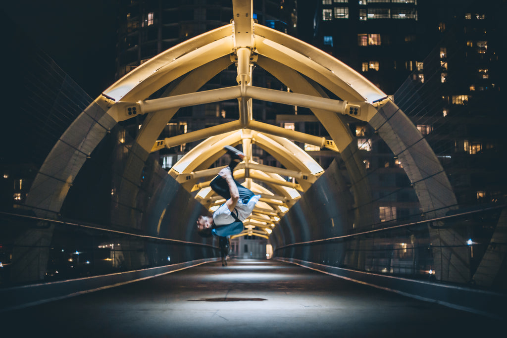 Backflip-on-bridge-at-night