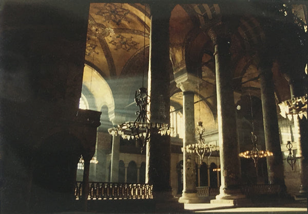 Dramatic light flowing through the architecture of the Hagia Sophia.