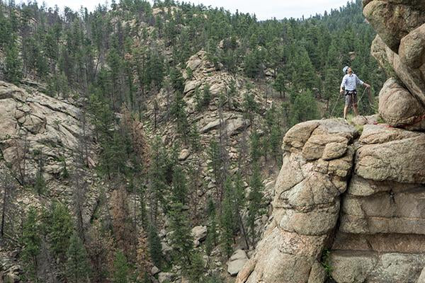 Stefan climbing the cliffside