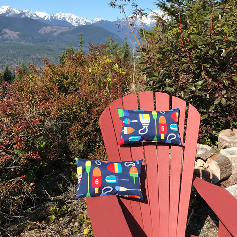 Adirondack Chair with pillows on it and mountains in the background