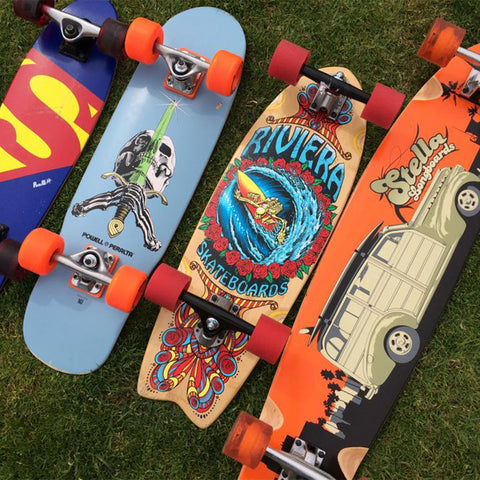 Four complete skateboards, including a Riviera Skateboard and Stella Longboard