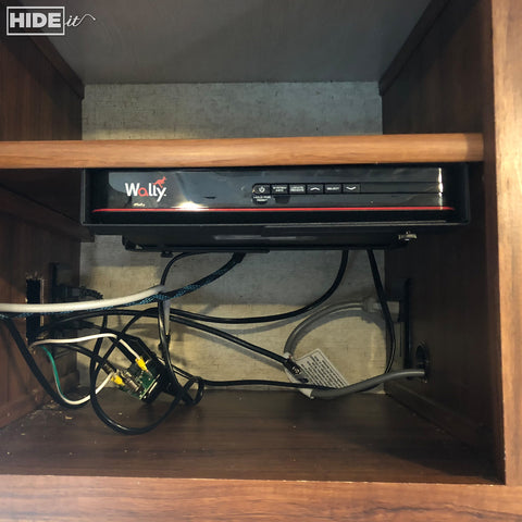 HIDEit Mounts under-shelf storage solution for cable box in RV.