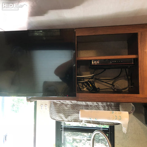 HIDEit Uni-M mount for under-shelf cable box storage in RV.