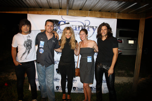 Ryan and his wife Lynn with The Band Perry