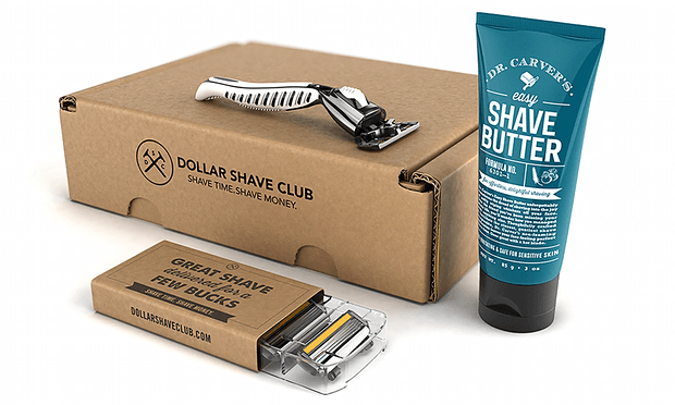 Dollar shave club subscription box featuring a razor, raxor blades, and shave butter