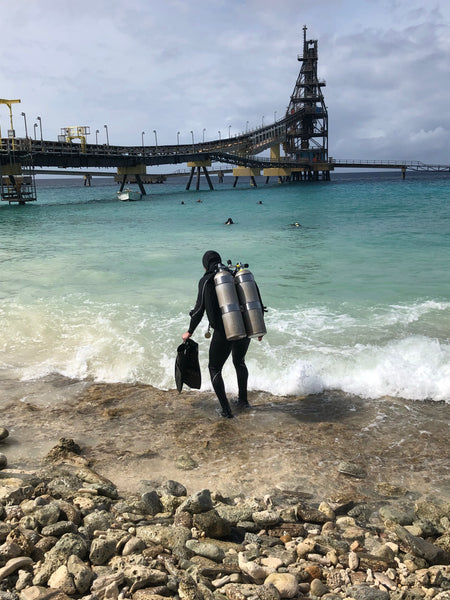 Nik timing his entry for his dive at Salt Pier Bonaire