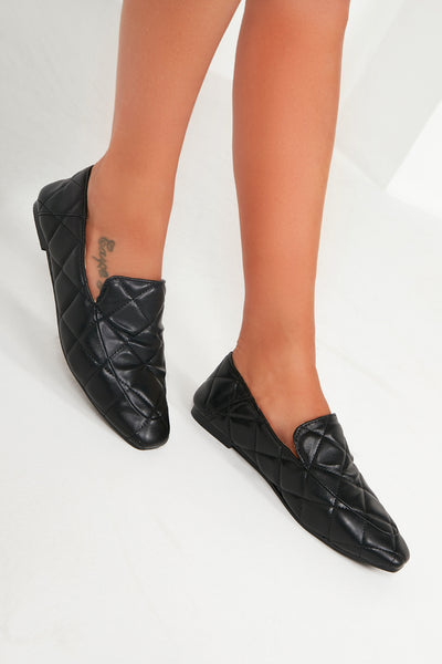 black quilted loafers