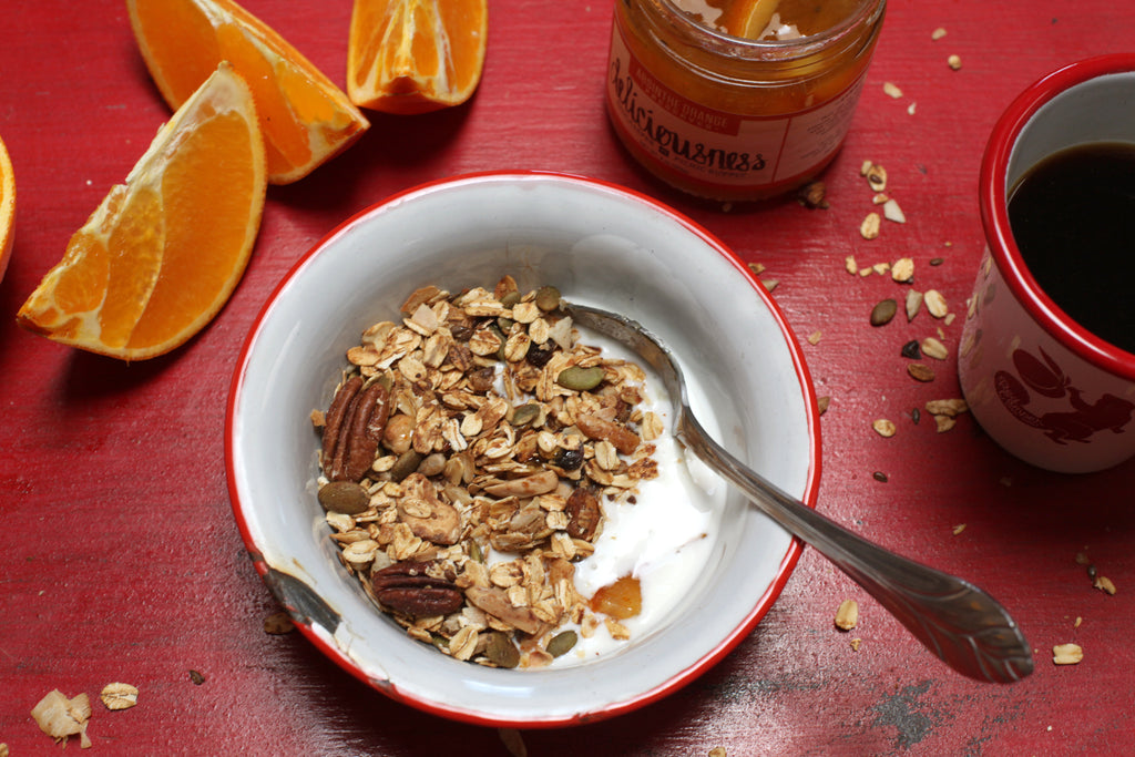 A bowl of RedCamper Deliciousness Absinthe Orange Granola in oat milk 