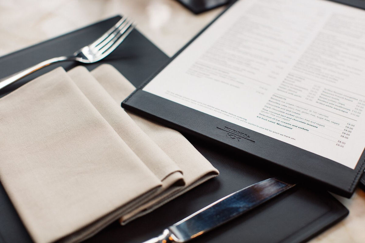 Bespoke leather tableware, menu holder and place mat