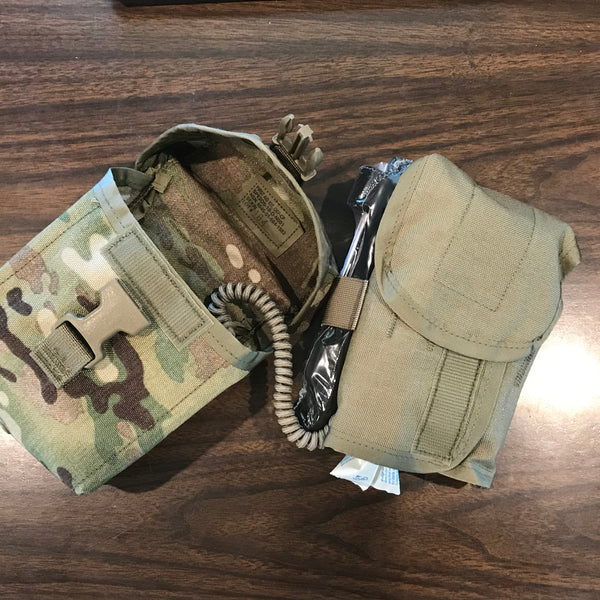 The Improved First Aid Kit holds an organizer insert with the actual contents, tethered to the main Multicam MOLLE Pouch by a lanyard.