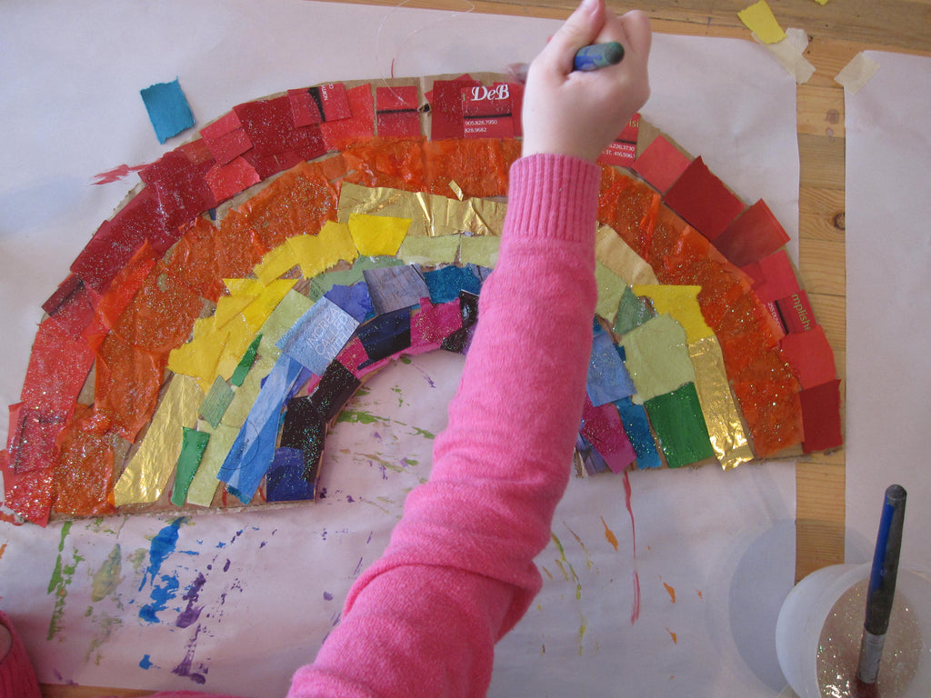 kids making a rainbow paper craft at collage collage
