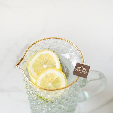 pitcher of marrakesh mint iced tea and lemon wheels