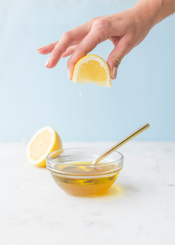 Lemon squeezed over Jasmine Mist Dressing in bowl