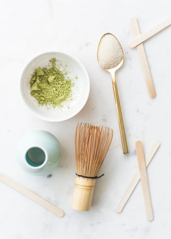 bowl filled with organic matcha near whisk 