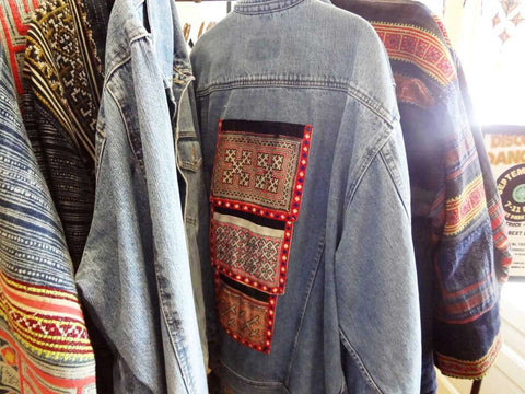 Denim jackets with inset swaths of colorful fabrics handmade by mountain tribes in southeast Asia are popular at the Elephant Story.