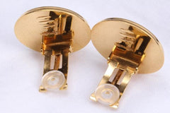 Vintage Hermes cloisonne golden round earrings with female lion design on white and light grey. Great gift idea
