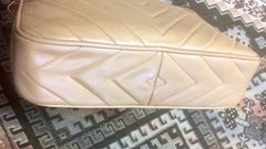 Vintage Chanel beige lamb leather 2.55 camera bag style chain shoulder bag with fringe and CC stitch mark. Chevron diamond shape stitches