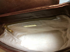 Vintage Bottega Veneta intrecciato shoulder bag, woven leather purse in multicolor of bronze, red, orange, green, and blue.