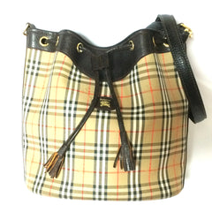 Vintage Burberry classic brown nova check hobo bucket shoulder bag with dark brown leather trimmings and drawstring tassels. Unisex