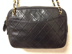 80's vintage CHANEL black lambskin medium size classic purse with double gold tone chain straps and a CC pull charm.