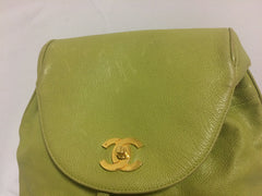 Vintage CHANEL green caviar leather backpack with gold chain strap and CC closure. Classic but rare color.