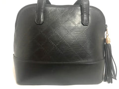 Vintage Gianni Versace black leather bolide shape handbag with a tassel and golden sunburst charms. Lady Gaga style.