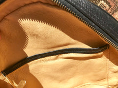 Vintage MCM black monogram round shape Suzy Wong shoulder bag with leather trimmings and fringes. Unisex bag
