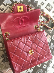 Vintage CHANEL deep red lambskin mini 2.55 bag with golden CC and chain strap. Classic Chanel red bag back in the era.