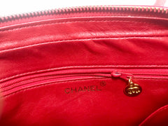 Vintage Chanel red lambskin camera bag style chain shoulder bag with fringe and CC stitch mark. Classic daily purse.