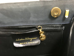 Vintage Salvatore Ferragamo navy grey suede leather handbag with gold tone vara charm with embossed logo and shoulder strap.