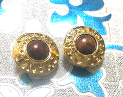 Vintage CHANEL gold tone earrings with wood and engraved logo. Rare must-have jewelry piece. Great vintage gift.