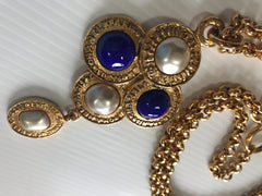 Vintage CHANEL pearl and blue stone necklace with logo engraved golden medal charm top. Dangle pendant top statement necklace.