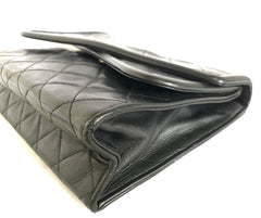 Vintage CHANEL black leather double envelop style flap shoulder bag with chain strap and fringe.
