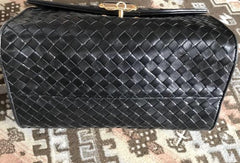 1990s. Vintage Bottega Veneta classic black lamb leather intrecciato handbag with golden closure hock. Gorgeous masterpiece from Bottega.