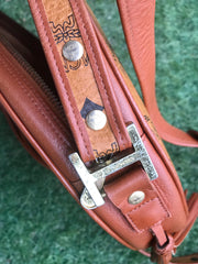 Vintage MCM brown monogram round Suzy Wong shoulder bag with brown leather trimmings. Designed by Michael Cromer. Made in Germany.