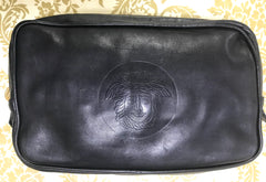 Vintage Gianni Versace black leather purse pouch, case bag with its iconic medusa face and golden logo motif charm. Unisex bag.