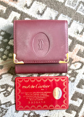 Vintage Cartier genuine wine leather square coin case with gold tone frames. must de Cartier. Unisex use.