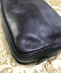 Vintage Gianni Versace black leather purse pouch, case bag with its iconic medusa face and golden logo motif charm. Unisex bag.