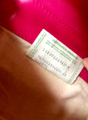 Vintage Bottega Veneta intrecciato woven leather purse in hot pink with unique opening closure motif. One of a kind