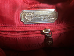 Vintage MCM genuine leather red mini hobo bucket shoulder bag with golden logo charms and fringes. Square stitch.Designed by Michael Cromer.