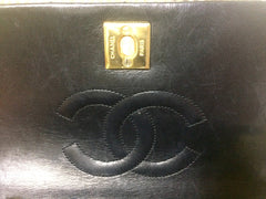 Vintage CHANEL black lambskin mini shoulder bag, classic 2.55 purse with gold tone CC closure.