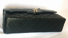 Vintage Chanel black 2.55 classic double flap bag with gold and silver CC motif and chains. Paris limited edition. Rare. Beautiful condition